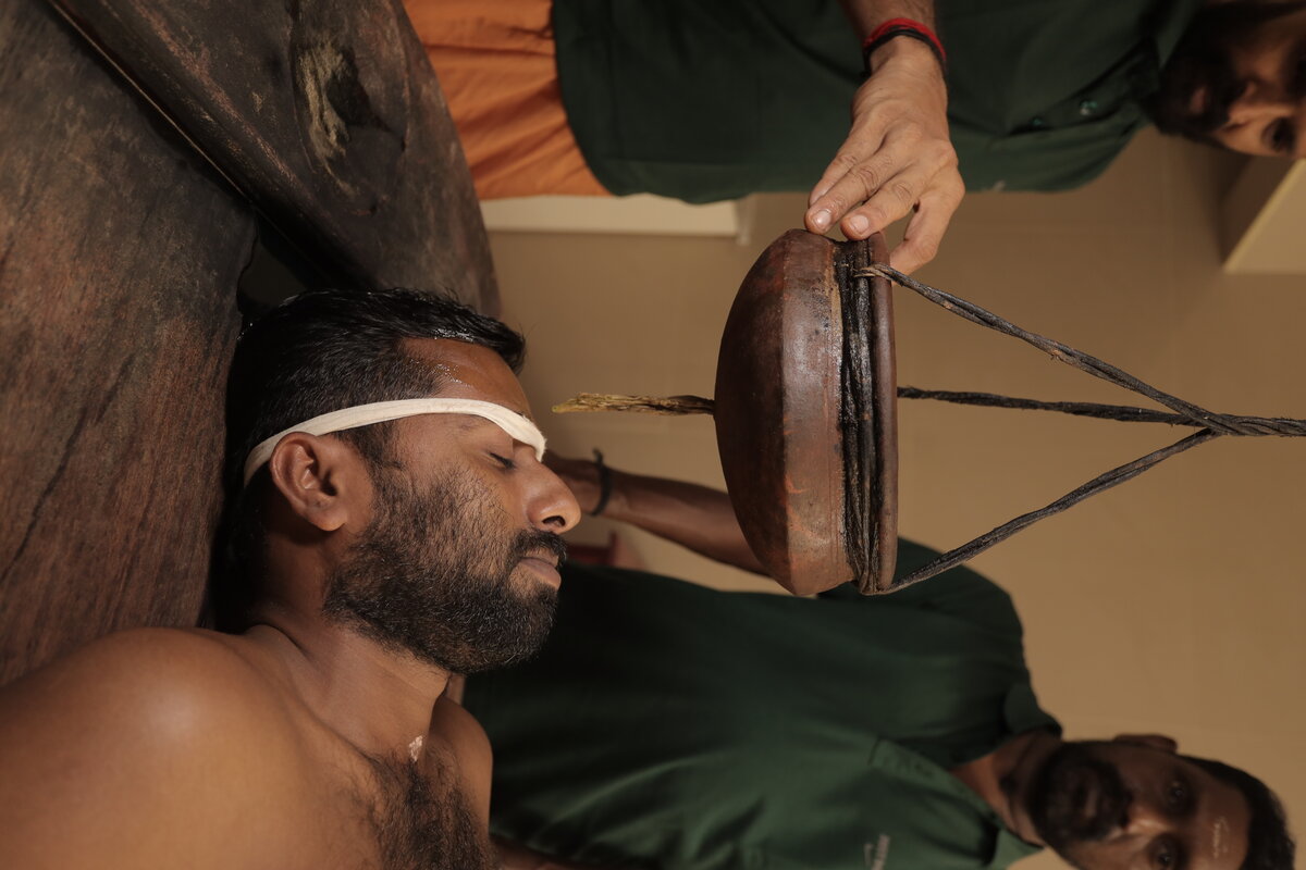 Traditional Shirodhara oil treatment